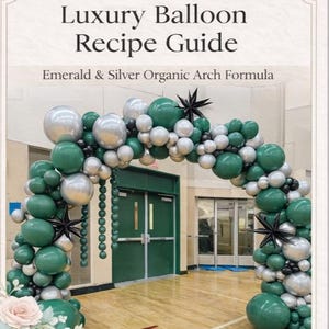 May include: A decorative balloon arch made of emerald green and silver balloons. The arch is in front of a green door. The text on the top of the image says "Luxury Balloon Recipe Guide" and "Emerald & Silver Organic Arch Formula".