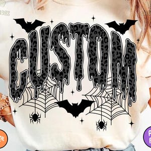 May include: Cream-colored t-shirt featuring the word "CUSTOM" in a dripping, leopard-print design. Includes bats, spiderwebs, spiders, and stars, creating a Halloween theme. The shirt also has the words "DIGITAL FILE" and "PNG FILE" on the bottom corners.