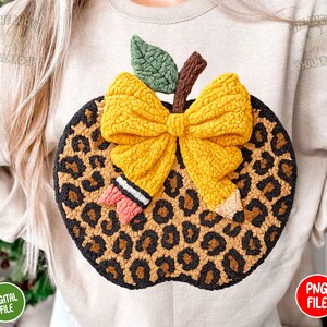 May include: A handmade apple-shaped decoration with a leopard print design. The apple features a yellow bow, a green leaf, and a brown stem. The words "DIGITAL FILE" and "PNG FILE" are visible.