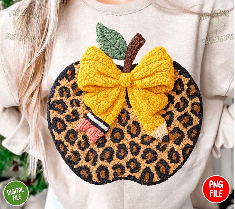May include: A handmade apple-shaped decoration with a leopard print design. The apple features a yellow bow, a green leaf, and a brown stem. The words "DIGITAL FILE" and "PNG FILE" are visible.
