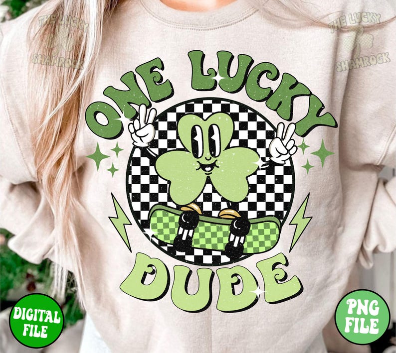 May include: A green shamrock cartoon character riding a skateboard with a checkered pattern. The character is wearing a peace sign and has a happy expression. The text "One Lucky Dude" is written in a retro font around the character.