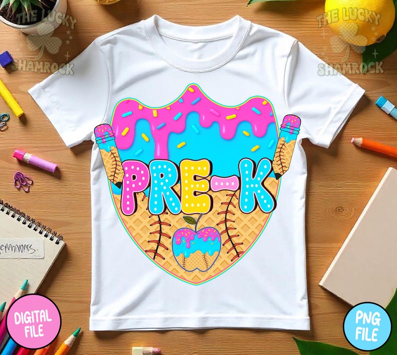 May include: White t-shirt with a colorful graphic design for Pre-K. The design features a donut with pink frosting and blue sprinkles, a baseball, and pencils. The word "PRE-K" is in large, colorful letters.