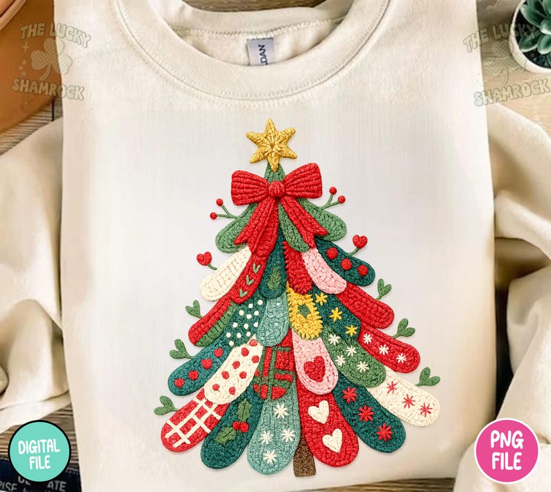 May include: Cream-colored sweatshirt featuring a colorful Christmas tree design. The tree is made of various patterned elements in red, green, yellow, and white, topped with a gold star and a red bow. The Lucky Shamrock and PNG File logos are visible.