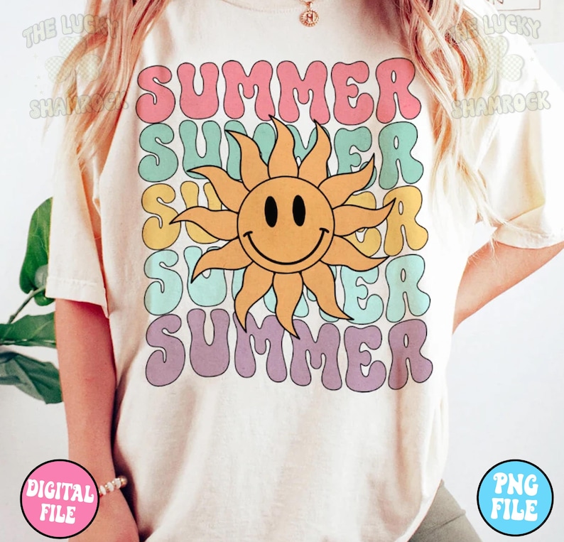 May include: A white t-shirt with a retro-style graphic design featuring the word "SUMMER" repeated in different colors and a smiling sun in the center.