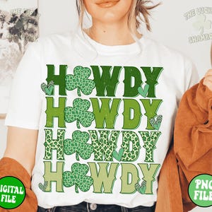 May include: White t-shirt with the text "Howdy" repeated four times in green, shamrock, and leopard print designs.