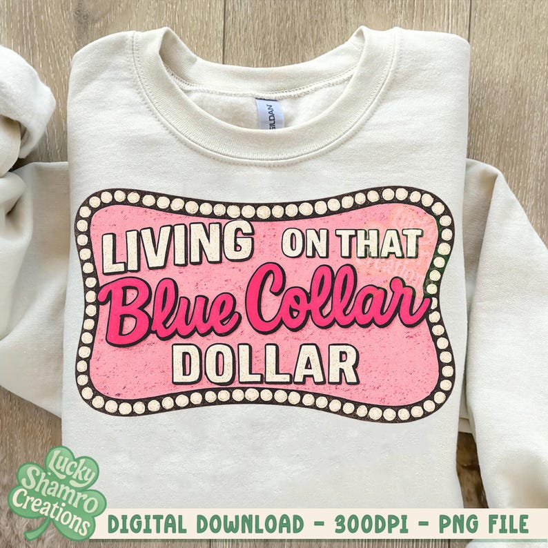 May include: Cream-colored sweatshirt with a pink and white graphic that reads "LIVING ON THAT Blue Collar DOLLAR." The design is framed with a dotted border. The sweatshirt is a digital download.