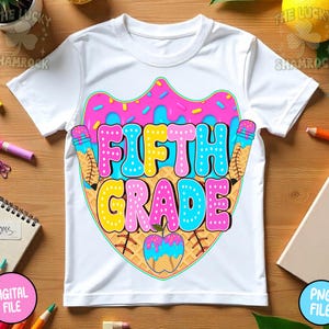 May include: White t-shirt with a colorful graphic design. The design features the words "FIFTH GRADE" in bubble letters, surrounded by ice cream cones and a baseball-themed apple. The design is in pink, blue, yellow, and brown.