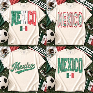 May include: A collection of four off-white short-sleeve t-shirts featuring various graphic designs of the word MEXICO in green, white, and red colors, some including the Mexican flag, displayed alongside soccer balls and flag banners.