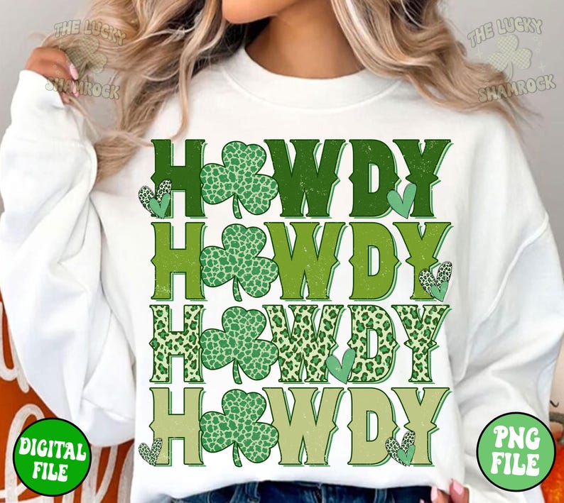 May include: White sweatshirt with a green, white, and brown graphic design that says "Howdy" four times. The graphic design features shamrock and leopard print patterns.