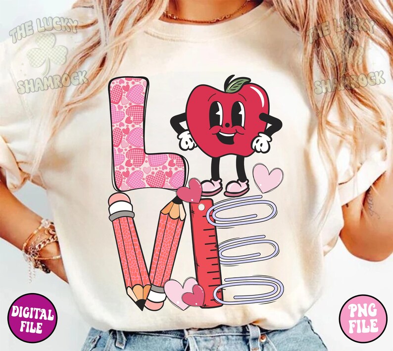 May include: A white t-shirt with a pink, red, and purple graphic design that says "LOVE" with a red apple character and school supplies.