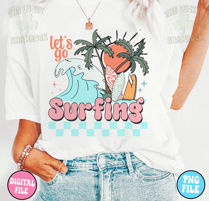 May include: White t-shirt with a graphic design of a wave, palm trees, a sunset, and surfboards. The text "Let's go Surfing" is in pink letters.