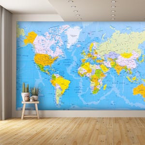 May include: A blue and yellow world map with country borders and ocean outlines. The map is printed on a white background and has the words "The World" at the bottom.
