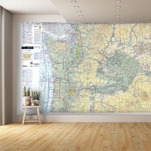 May include: A detailed map of the Pacific Northwest region of the United States, printed on a large sheet of paper. The map shows major cities, highways, and geographical features. The map is in a light blue, green, and brown color scheme.