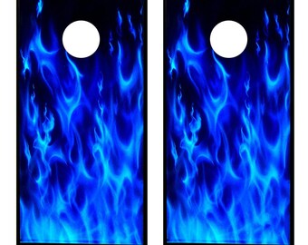 May include: Two blue flame design cornhole boards. The boards are black with a blue flame design and a white circle in the center.