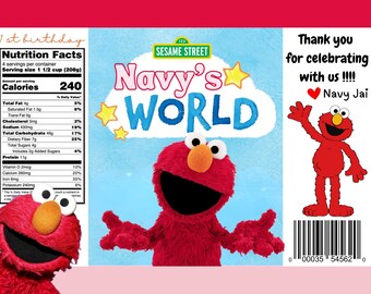 May include: A red Sesame Street Elmo character with a blue background. The text "Navy's World" is written in large, colorful letters. The text "123 Sesame Street" is written in smaller letters. The text "Thank you for celebrating with us!!! Navy Jai" is written in black letters on a white background. A barcode is at the bottom of the image.