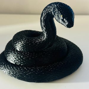 Black Python shelf sitter snake accessory bookshelf