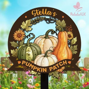 May include: A decorative wooden sign featuring a pumpkin patch design. The sign has a brown circular frame with the text "Stella's" at the top. Inside the frame are illustrations of pumpkins, sunflowers, and leaves. The words "PUMPKIN PATCH" are on a banner.