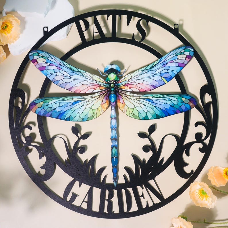 May include: Black metal circular garden sign with a colorful dragonfly design and the text "Pat's Garden".