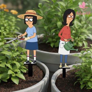 May include: Two decorative garden stakes featuring cartoon characters. One character wears a straw hat, blue shirt, and skirt while holding shears. The other character wears a red shirt, white apron, and blue pants while holding a green watering can.
