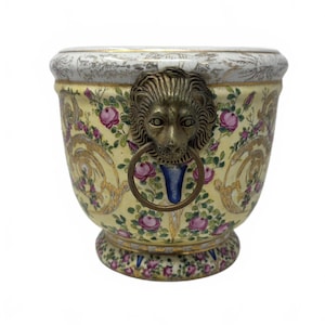 May include: A white ceramic mug with a black handle and the text "But first, coffee" in a handwritten style. The mug is on a white surface. The mug is 4 inches tall.