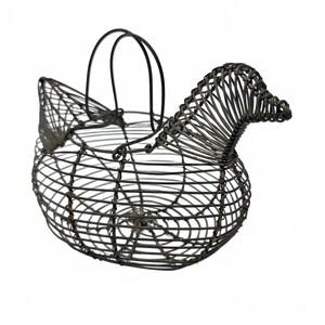 May include: A dark gray wire basket shaped like a chicken, featuring a rounded body, a raised head, and a tail section. The structure is formed by thin metal wire coils and includes two arched wire handles attached to the top of the basket.