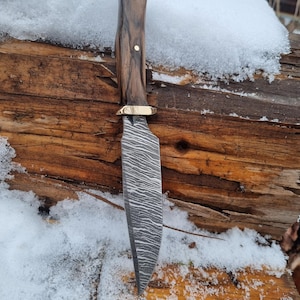 Handmade special outdoor knife . Hidden tang light weigth design . Stripe pattern finish on blade .Walnut handle.