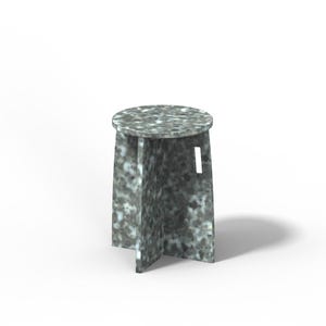 May include: A round, gray and white speckled stool with a unique, four-legged design.