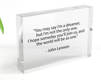 May include: A clear acrylic block with the John Lennon quote: "You may say I'm a dreamer, but I'm not the only one. I hope someday you'll join us, and the world will be as one." The quote is in black text.