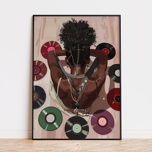 May include: A framed art print depicting a woman with dark skin, wearing layered necklaces, with her arms behind her head. The artwork includes vinyl records in various colours, including red, green, and purple, against a pink background.