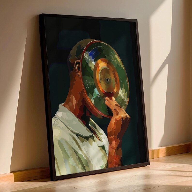 May include: A framed art print featuring a person with a vinyl record in place of a head. The artwork has a dark background with the person wearing a light green shirt. The vinyl record is green, orange, and blue.