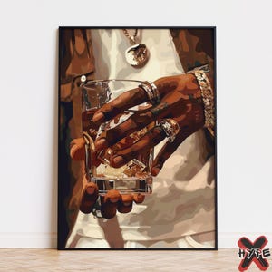 May include: A person's hand holding a glass of amber liquid with ice cubes. The hand is wearing several gold rings and a thick gold chain bracelet.