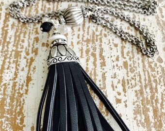 Long black leather tassel necklace.