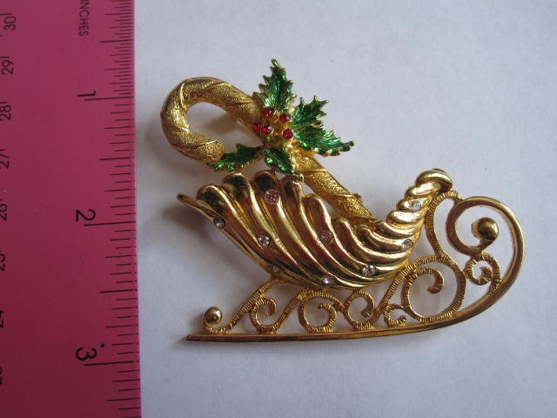 Large JJ Christmas Fancy Sleigh Brooch with Candy Cane Holly Crystal Rhinestones Gold Tone Signed Pin