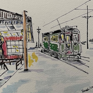 May include: A hand-drawn illustration of a green and red train car with the number 749 on the side. The train is parked in front of a red building with a sign that says "TO TRAIN".