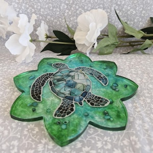 Large Resin sea turtle coaster.Beautiful tones of green with abalone shell peices inlayed, and turtle design.One off and unique piece.