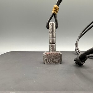 Mens norse hammer pendant, damascus steel mjolnir necklace, viking mythology jewelry gift for him, hand forged steel pendant, unique mens steel necklace, artisan norse symbol pendant, hammer necklace men, myth inspired jewelry 2025 trending.