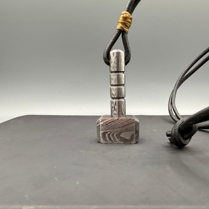 Mens norse hammer pendant, damascus steel mjolnir necklace, viking mythology jewelry gift for him, hand forged steel pendant, unique mens steel necklace, artisan norse symbol pendant, hammer necklace men, myth inspired jewelry 2025 trending.