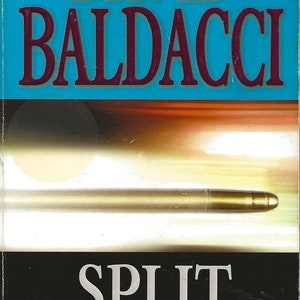 May include: A book cover with a blue background and the title "SPLIT SECOND" in white text. The author's name, "DAVID BALDACCI", is in red text above the title. The book cover also features a silver bullet and the text "#1 NEW YORK TIMES BESTSELLER" in white text.
