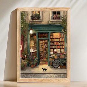 Peut inclure: Une impression encadrée d'une façade de librairie pittoresque. La porte turquoise est flanquée de jardinières et d'un vélo. Un chat noir se tient sur la rue pavée. L'enseigne au-dessus de la porte indique "BOOK STORE".