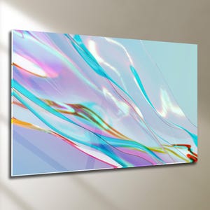 以下が含まれることがあります： 青、ターコイズ、ピンク、ゴールドの色合いの、流れるような半透明のリボンが特徴の抽象的なウォールアート。アートワークは光沢のある仕上がりで、水色の背景にマウントされています。全体的な効果は、ダイナミックでカラフルなディスプレイです。