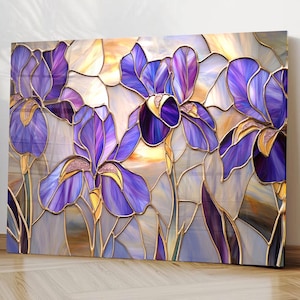 May include: A rectangular wall art piece featuring a stained glass style illustration of purple iris flowers. The design uses bold gold outlines to separate segments of deep violet, lavender, and cream colors, creating a mosaic effect.