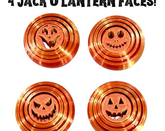 May include: Four orange Jack O'Lantern faces with different expressions. Each face is a circular design with concentric rings. The text "4 Jack O'Lantern Faces!" is at the top. Perfect for Halloween decorations.