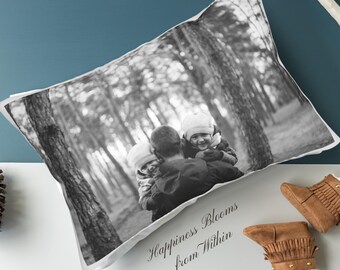 May include: Black and white photo of a family in a forest. A father is holding two children, one on each side of him. The photo is printed on a white pillowcase with the text "Happiness Blooms from Within".