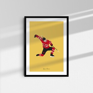 May include: A digital illustration of a hockey player in a red and white jersey with a Canadian flag on the chest, skating on a yellow background. The player is holding a hockey stick and is in a dynamic pose. The text "Game Frame" is at the bottom of the image.