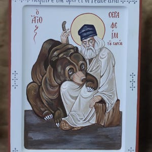 Hand-painted icon of Saint Seraphim of Sarov with a bear, measuring 20x15x2.5 cm
