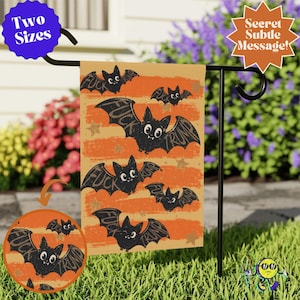 May include: A rectangular garden flag featuring a repeating pattern of black cartoon bats on an orange background with horizontal distressed stripes and gold stars. The text "FUCK TRUMP" is integrated into the wings of each bat. The flag is displayed on a black metal stand.