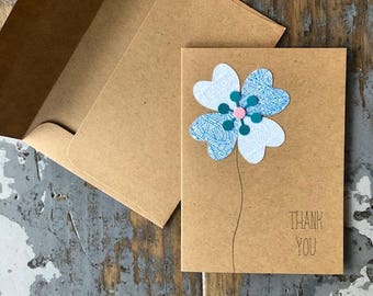 Enveloppe recyclée carte fleur Merci blanc à l’intérieur