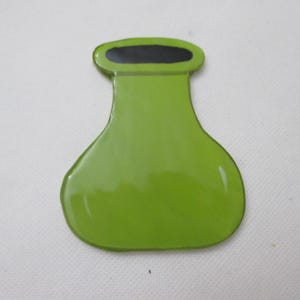 May include: A flat, glossy, lime green chemical flask shaped object with a smooth finish. The top opening of the flask is defined by a solid black oval shape, creating a distinct contrast against the vibrant green body of the vessel.