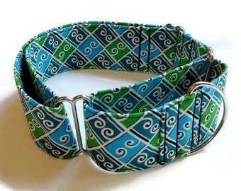 May include: A blue and green patterned dog collar with silver hardware. The collar is made of fabric and has a martingale style.