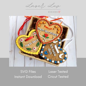 May include: Wooden heart-shaped ornaments with German text, displayed in a woven basket. The ornaments feature decorative floral designs and colorful borders in red, yellow, and blue. Each ornament has a ribbon for hanging.